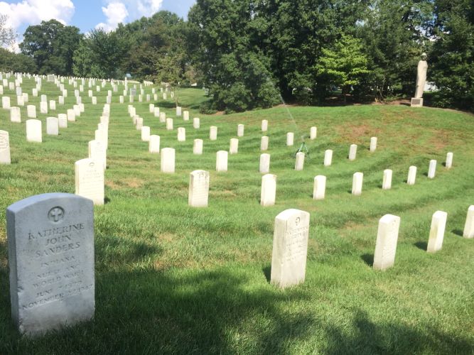 Image of rows of white tombstones in Arlington National Cemetery